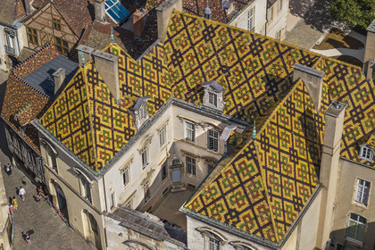 France, Cote d'Or, Dijon, area listed as World Heritage by UNESCO, colorful glazed tile roof of the Hotel de Vogüé (aerial view)