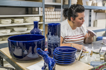 France, Nièvre, Nevers, Faïencerie Georges, the workshop, Manon retouching the plates