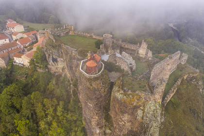 France, Haute Loire, Loire river Valley, Arlempdes, labelized the Most Beautiful Villages of France, ruins of the castle perched on a basalt rock (volcanic dyke) overlooking a Loire river meander (aerial view)
