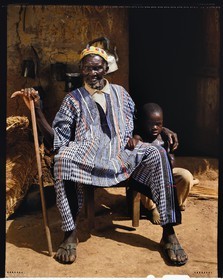 Burkina Faso, Poni province, Lobi land, Loropéni region, old man of the Gan ethnic group with one of his grandchildren in the village of Obire