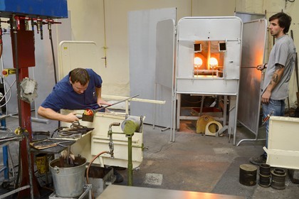 France, Moselle, Saint-Louis-les-Bitche, the Cristallerie Saint-Louis (Saint-Louis crystal glass manufacturer), glassblower using a wooden tool called mailloche to round up the crystal and make a bowl which is even, one of the many steps of the realization of a paperweight