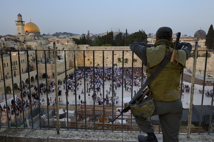 Israel, Jerusalem, holy city, the old town listed as World Heritage by UNESCO, the Western Wall part of the retaining walls of the Temple Mount built by Herod the Great under the surveillance of an armed soldier