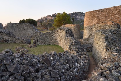 Zimbabwe, Masvingo province, the ruins of the archaeological site of Great Zimbabwe, UNESCO World Heritage List, 10th-15th century, exterior wall north-east entrance from inside of the Great Enclosure and the Hill Complex in the background