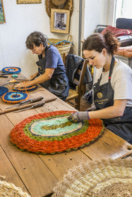 France, Drome, Drome provencale, Nyons, La Scourtinerie, the last scourtin factory in Provence, traditional filters used in the production of olive oil but also designed today as decorative objects made of coconut fiber, hand finishing of scourtins by Sophie Villeneuve-Fert and her mother Frédérique
