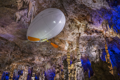 France, Gard, Mejannes-le-Clap, grotte de La Salamandre (Salamander cave), discovery of the cave in Aéroplume®, an individual dirigible balloon inflated with helium which allows you to fly away by flapping your wings