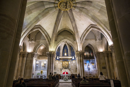 Spain, Catalonia, Barcelona, Eixample district, Sagrada Familia basilica by Catalan modernist architect Antoni Gaudi, listed as a UNESCO World Heritage Site, the neo-Gothic style temple crypt serves as a parish church, priest Joby Sebastian Kappiparambil celebrates mass