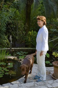 France, Alpes Maritimes, Cannes, the Villa La Californie where Picasso lived, today renamed the Pavillon de Flore by Marina Picasso, Marina Picasso granddaughter of Picasso with her dogs in the garden