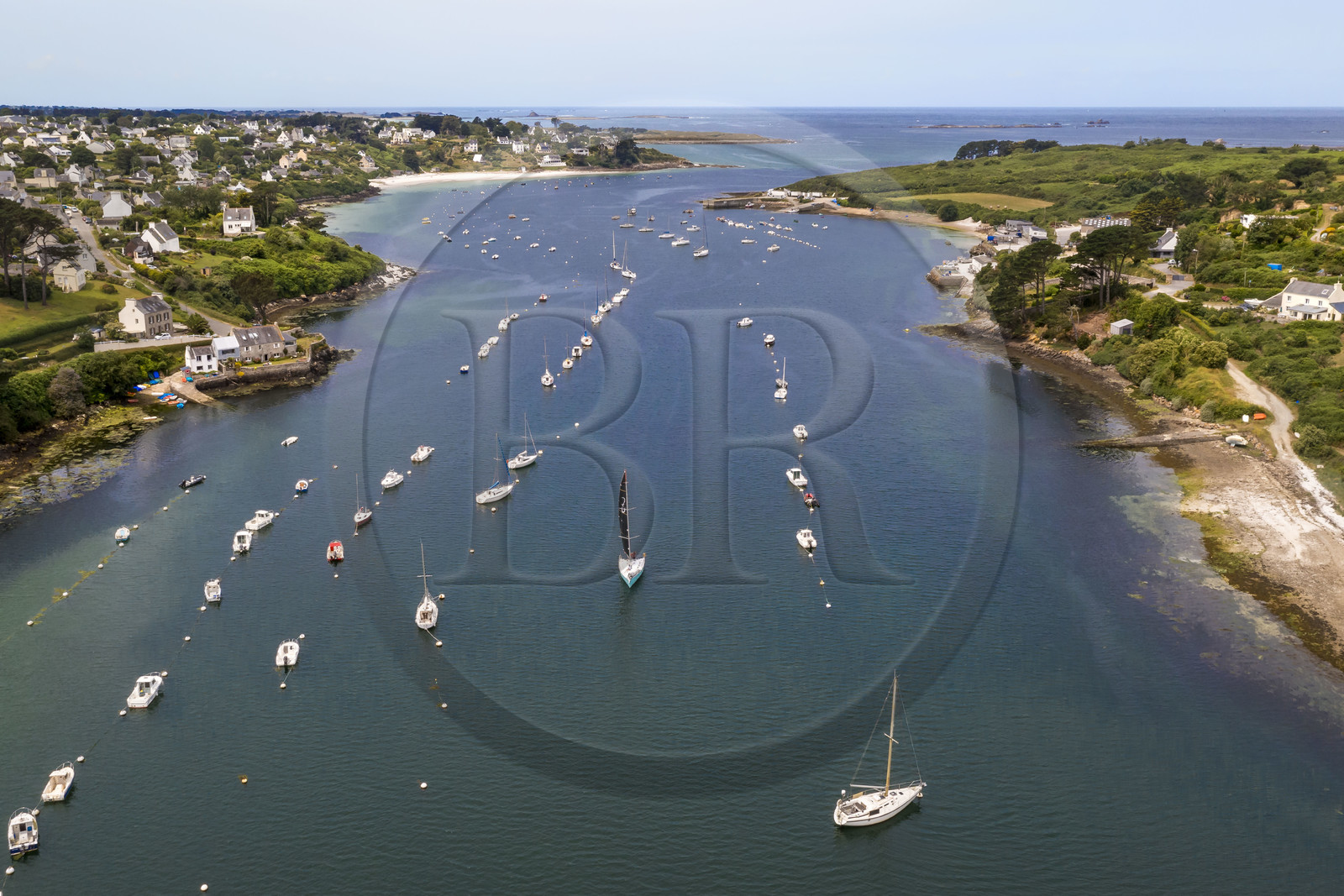 France, Finistère, Abers Country (Pays des Abers), boats at anchor in the Aber Benoit estuary between Saint-Pabu on the left and Landeda on the right (aerial view)