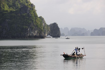 Vietnam, Quang Ninh Province, Halong Bay, listed as World Heritage by UNESCO, fishing boat
