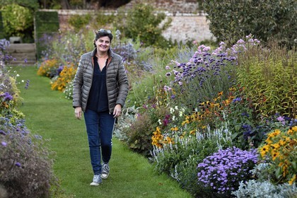 France, Seine-Maritime, Pays de Caux, Tourville sur Arques, château de Miromesnil, birthplace of the French writer Guy de Maupassant, the owner Nathalie Romatet in the very flowery vegetable garden
