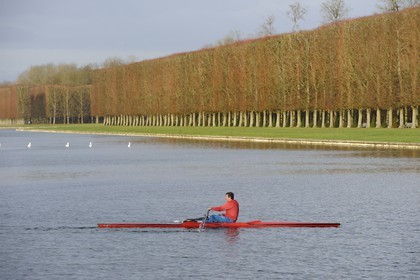 France, Yvelines, parc du Chateau de Versailles, listed as World Heritage by UNESCO, small boats on the Grand Canal in Autumn
