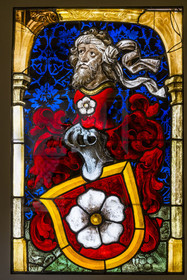 France, Paris, Musée de Cluny - Musée national du Moyen-Age (Middle Ages Museum in the former Hotel de Cluny), stained glass window representing the arms of the Mullenheim family, donor in prayer, Upper Rhine (Alsace), early 16th century