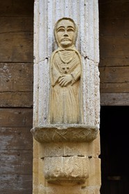 France, Dordogne, Perigord Pourpre, Monpazier, labelled Les Plus Beaux Villages de France (The Most Beautiful Villages in France), statue in front of the door from the western facade of St. Dominic church