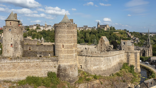 France, Ille-et-Vilaine, Fougeres, 12th century fortified castle and the Saint-Sulpice church, the Saint-Léonard church in the background (aerial view)