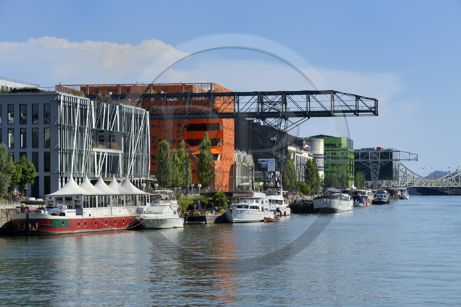 France, Rhone, Lyon, La Confluence new district in the South of the Presqu'ile (Peninsula), Quai Rambaud, the Orange Cube by Dominique Jakob and Brendan MacFarlane architects and the green building of Euronews headquarters in the background