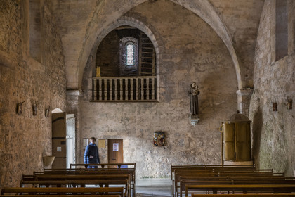 France, Aveyron, Causses and the Cévennes, cultural landscape of Mediterranean agro-pastoralism, listed as World Heritage by UNESCO, La Couvertoirade, labelled Les Plus Beaux Villages de France (The Most Beautiful Villages of France), fortified village on the Larzac plateau, Saint-Christol church, the baptismal font on the right