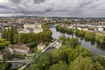 France, Yonne, Auxerre, Batardeau lock on the Yonne at the tip of the Arbre Sec landscaped park, the town center and the quays in the background (aerial view)
