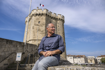 France, Charente Maritime, La Rochelle, the Old Port, Tour Saint Nicolas protects the entrance to the Old Port, the writer and local historian Mickael Augeron