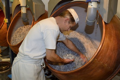 France, Meuse, Verdun, Braquier sugared almonds (dragee) factory, peeling almonds, operation designed to cover the almonds with a film and prevent oil from migrating to the outside