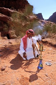 Jordan, Wadi Rum, smoking a water pipe with fragrant tobacco is a moment of relaxation during the day