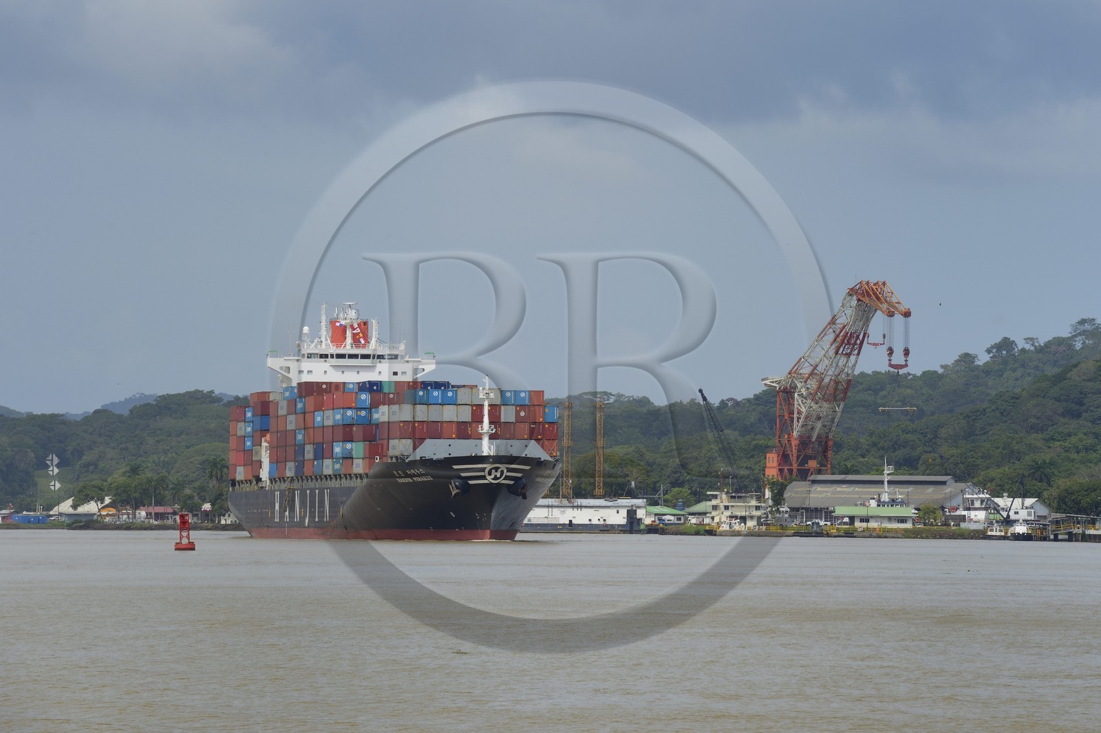 Panama, Panama Canal at Gamboa, Korean Panamax container cargo, Titan crane built by Nazi Germany in the background