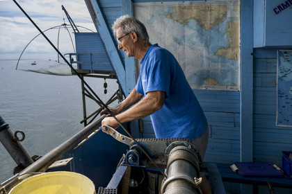 France, Loire Atlantique, Estuaire de la Loire, Saint Nazaire, Trébézy beach, fisherman Roland Dupont in his traditional carrelet (fishing shack)