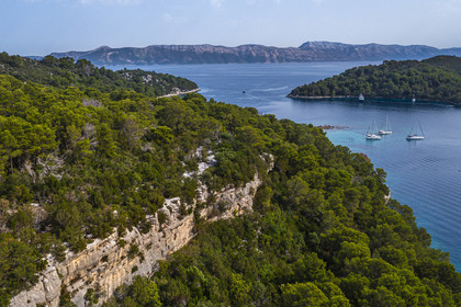 Croatia, Dalmatia, Dalmatian coast, Island of Mljet, National Park of Mljet, anchorage of sailboats in the bay of Polace (aerial view)