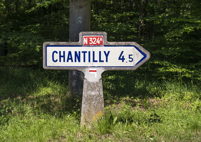 France, Oise, Chantilly, Michelin road sign indicating the direction of Chantilly