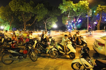 Vietnam, Hanoi, old town, Hoan Kiem Lake also called the small lake or Lake of the Restored Sword, going out on saturday night on motorbike