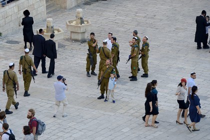 Israel, Jerusalem, holy city, the old town listed as World Heritage by UNESCO, ortodox jews and soldiers under the Temple Mount or Haram Ash-Sharif
