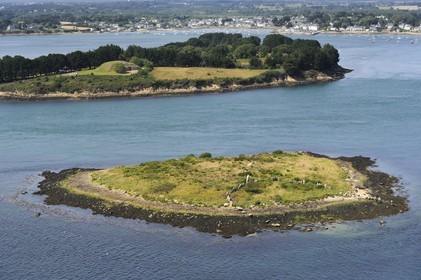 France, Morbihan, Gulf of Morbihan (Golfe du Morbihan), Er Lannic island with a megalithic site Cromlech, in the background the Gavrinis cairn on the Gavrinis island in front of the town of Larmor Baden (aerial view)