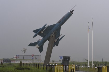 Romania, Transylvania, Cluj region, Turda, fighter aircraft on a roundabout at the entrance of Campia Turzii
