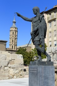 Spain, Aragon, Zaragoza, statue of Cesar Augustus and the leaning bell tower of the church of San Juan de Los Panetes