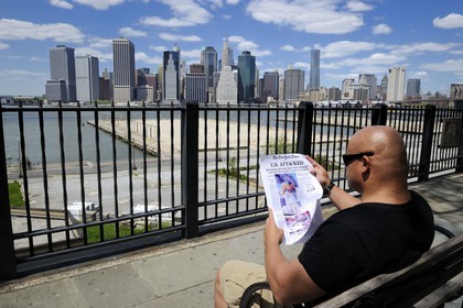 United States, New York, Downtown Manhattan seen from the Promenade in Brooklyn, reading again the New York Times announcing the attacks of September 11, 2001 on the twin towers of the World Trade Center 10 years after