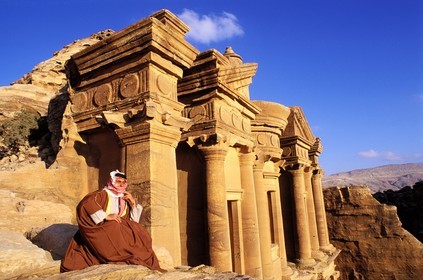 Jordan, Petra, a Bedouin contemplates the Sunset, halfway up El Deir ( the Monastery), 138 feet High, listed as World Heritage by UNESCO