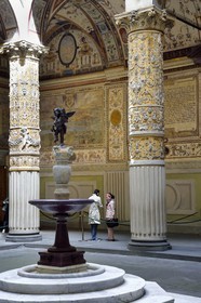 Italy, Tuscany, Florence, listed as World Heritage by UNESCO, the Palazzo Vecchio, Michelozzo's court with frescoes of Austrian cities on the wall by Giorgio Vasari, statue of the Child with the dolphin by Verrocchio