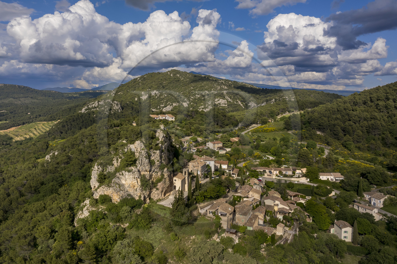 France, Vaucluse, Dentelles de Montmirail mountains, the hilltop village of La Roque-Alric and Mont Ventoux in the background (aerial view)