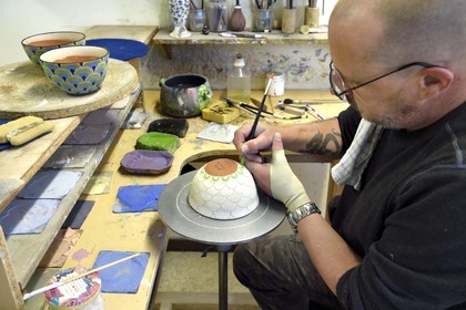 France, Alpes de Haute Provence, Parc Naturel Régional du Verdon, village of Moustiers Sainte Marie, labelled Les Plus Beaux Villages de France (The Most Beautiful Villages of France), city of ceramics, Stephane Maitral decorator-ceramist at the ceramics Serrailler