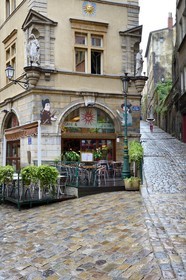 France, Rhone, Lyon, historical site listed as World Heritage by UNESCO, Vieux Lyon (Old Town), Saint George district, the place de la Trinite with the Café du Soleil served as the backdrop for the puppeteers putting on Guignol shows, and the montee du Gourguillon on the right