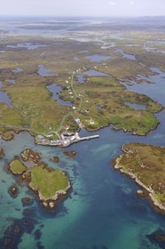 United Kingdom, Scotland, Outer Hebrides, Isle of North Uist covered with a patchwork of peat bogs, low hills and lochans, port of Grimsay (aerial view)