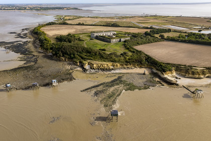 France, Charente Maritime, Port des Barques, Ile Madame, the fort built in 1703, the Insurgent Well and huts on stilts called carrelets at rising tide (aerial view)