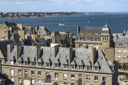 France, Ille et Vilaine, Cote d'Emeraude (Emerald Coast), Saint-Malo intramuros, former post office on the Place des Frères Lamennais, the coast of Dinard in the background