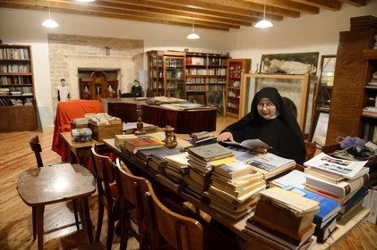 Croatia, Dalmatia, Dalmatian Coast, Sibenik, Convent of St. Lucia (samostan sv. Luce), Sister Fortunata studying in the common room