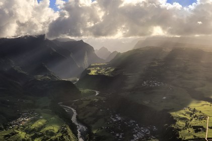 France, Reunion island (French overseas department), north-eastern coast between Sainte Suzanne and Saint Andre, sugar cane fields and the Gorges of the river Mat leading to the Cirque de Cilaos, listed as World Heritage by UNESCO (aerial view)