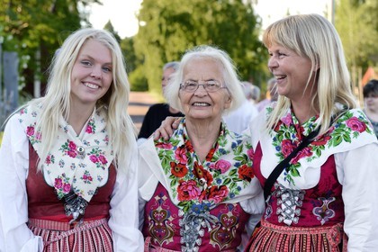 Sweden, Dalarna County, Leksand area, Midsummer celebrations in the tiny hamlet of Hjulbäck, three women in traditional costumes, grandmother, mother and daughter