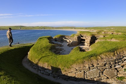 United Kingdom, Scotland, Orkney Islands, Isle of Mainland, ruins of Skara Brae prehistoric village, listed as World Heritage by UNESCO and the Bay of Skaill
