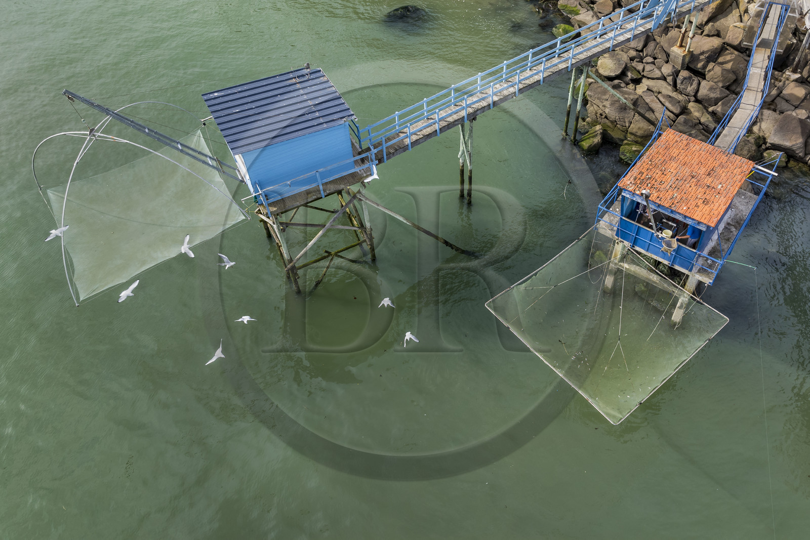 France, Loire Atlantique, Estuaire de la Loire, Saint Nazaire, Trébézy beach, fisherman Roland Dupont in his traditional carrelet (fishing shack) (aerial view)