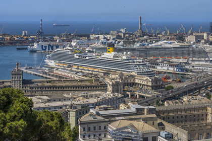 Italy, Liguria, Genoa, the commercial port and the passenger terminal dominated by the Lanterna lighthouse