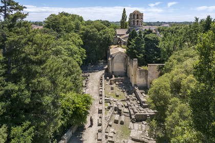 France, Bouches du Rhone, Arles, the Alyscamps, listed as World heritage by UNESCO, a pagan then Christian necropolis from the Roman era to the Middle Ages, comprising numerous sarcophagi, and the Saint-Honorat des Alyscamps church topped with its lantern of the dead (aerial view)