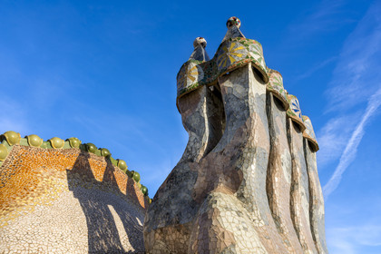 Spain, Catalonia, Barcelona, Eixample district, Passeig de Gracia, Casa Batllo by Catalan modernist architect Antoni Gaudi, UNESCO World Heritage site, chimneys and roof suggesting the dragon's spine